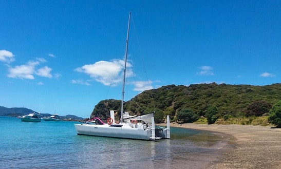 Charter 33ft Tennant Turissimo Cruising Catamaran In Paihia, New Zealand. Paihia Beach